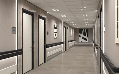 A hallway with resident doors and artwork