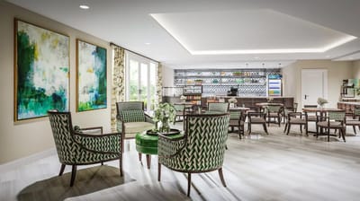 Bright common area with modern seating and decor