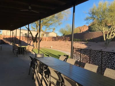 Outdoor patio area with seating and landscaping