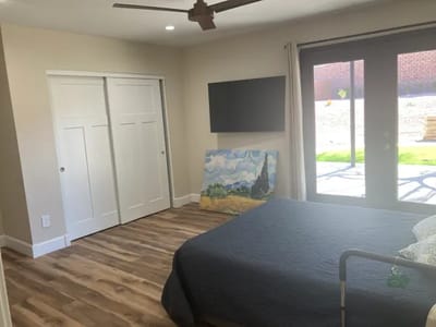 Comfortable bedroom with modern decor and natural light