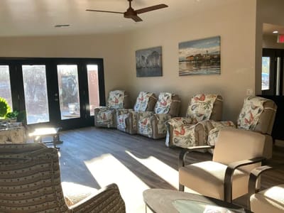 Bright common area with comfortable seating and artwork