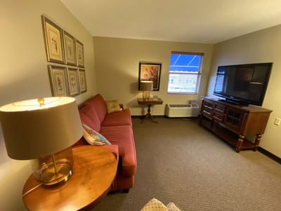 Cozy living room interior with a red couch and TV