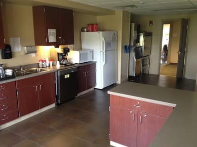 Interior view of kitchen with appliances and cabinets