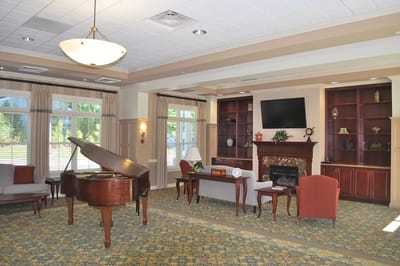 Common area with a piano and seating