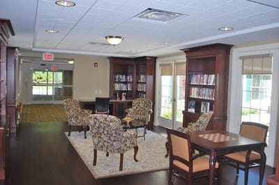 Cozy library area with seating and bookshelves