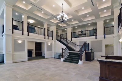 Bright and spacious lobby area with a staircase