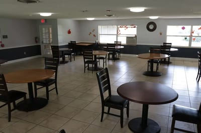 Dining area with empty tables and chairs arranged