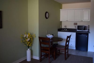 Cozy kitchenette and dining area in a resident room