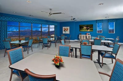 Bright common area with tables and chairs