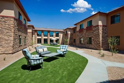 Outdoor seating area surrounded by the building