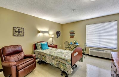 Private resident room with bed and seating area
