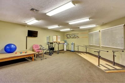 Interior view of a therapy room with exercise equipment