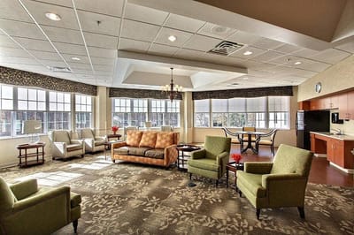 Bright common area with seating and windows