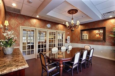Elegant common area with a dining table and chandelier