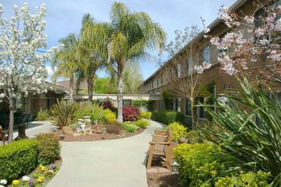 Landscape view of a scenic outdoor space with benches and gardens