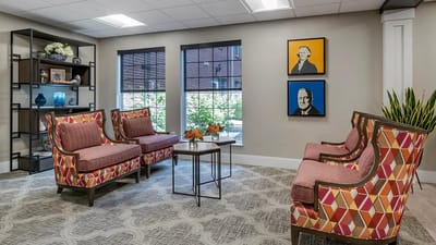 Bright common area with colorful seating and artwork