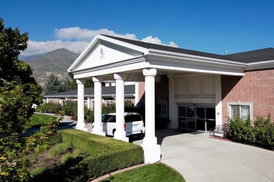Exterior view of assisted living facility with entrance
