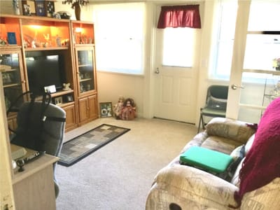 Cozy common area with a couch and door entrance