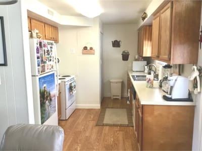 Bright kitchen area with appliances and decorations