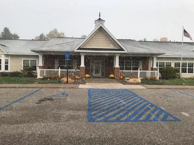 Front entrance of Cedar Cove Assisted Living facility in winter