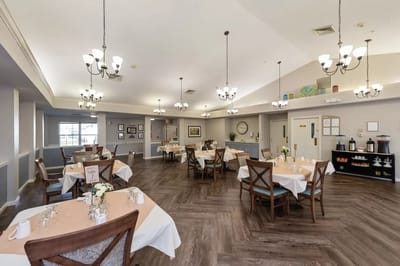 Bright dining room with tables set for meals