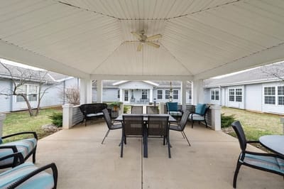 Outdoor seating area with tables and chairs