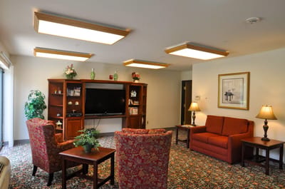 Comfortable common area with seating and TV