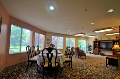 Bright common area with dining table and seating