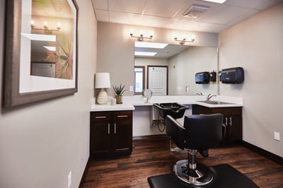 Beauty salon chair and mirror in a bright room