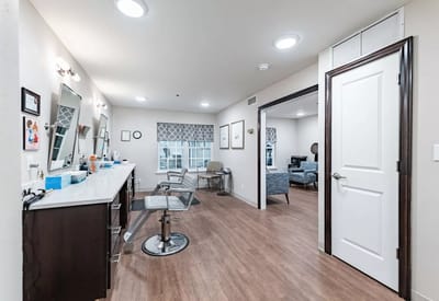 Interior of a salon area with mirrors and chairs