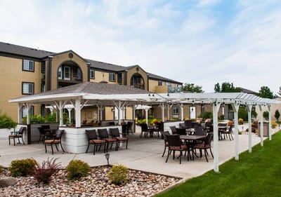 Outdoor seating area with pergolas and gardens