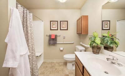 Well-lit bathroom in a senior living facility