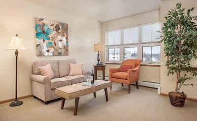 Cozy living room area with seating and art