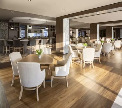 Bright dining area with tables and chairs