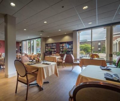 Bright dining area with tables set for meals