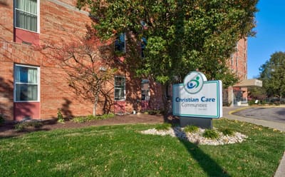 Facility logo sign in front of the building
