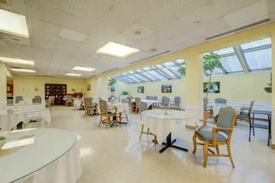 Bright dining area with tables and chairs
