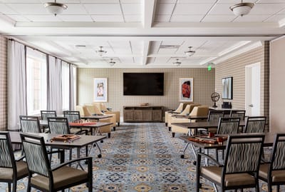 Interior common area with seating and game tables