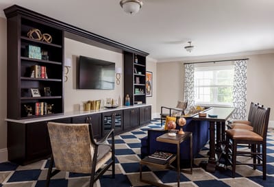 Bright common area with seating and decorative shelves