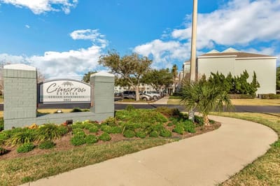 Exterior view of Cimarron Estates sign and landscaping