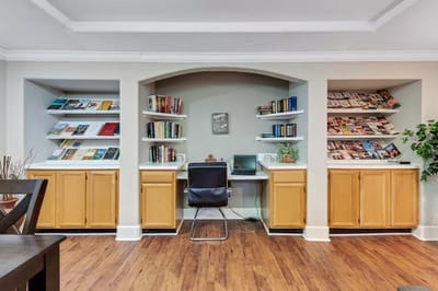Interior view of a common area with bookshelves and seating