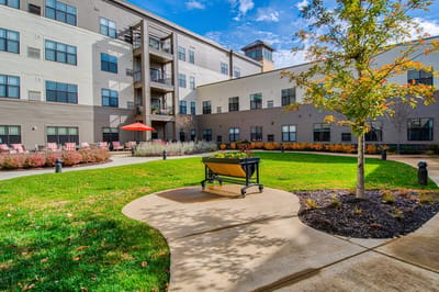 Outdoor courtyard with benches and garden areas