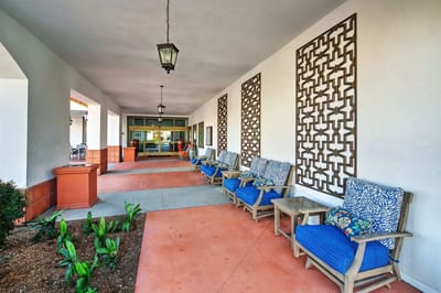 Outdoor seating area with blue chairs and decorations