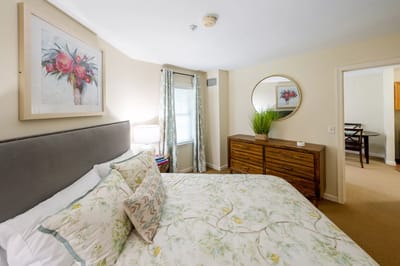 Brightly decorated resident bedroom with floral decor