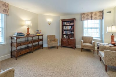 Cozy common area with seating and bookshelves