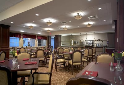 Dining room with tables set for residents