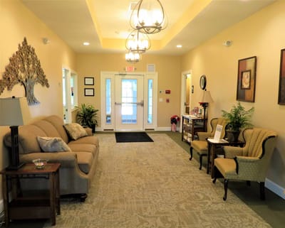 Well-decorated lobby with seating and plants