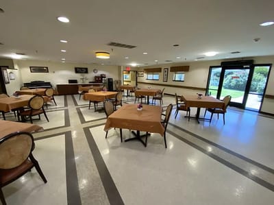 Dining room with tables and chairs set up