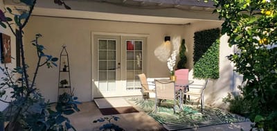 Outdoor patio area with table and chairs