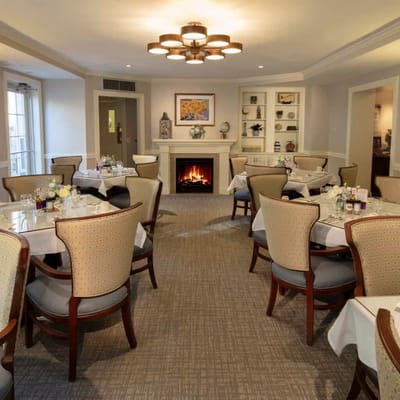Elegant dining room with tables set for meals